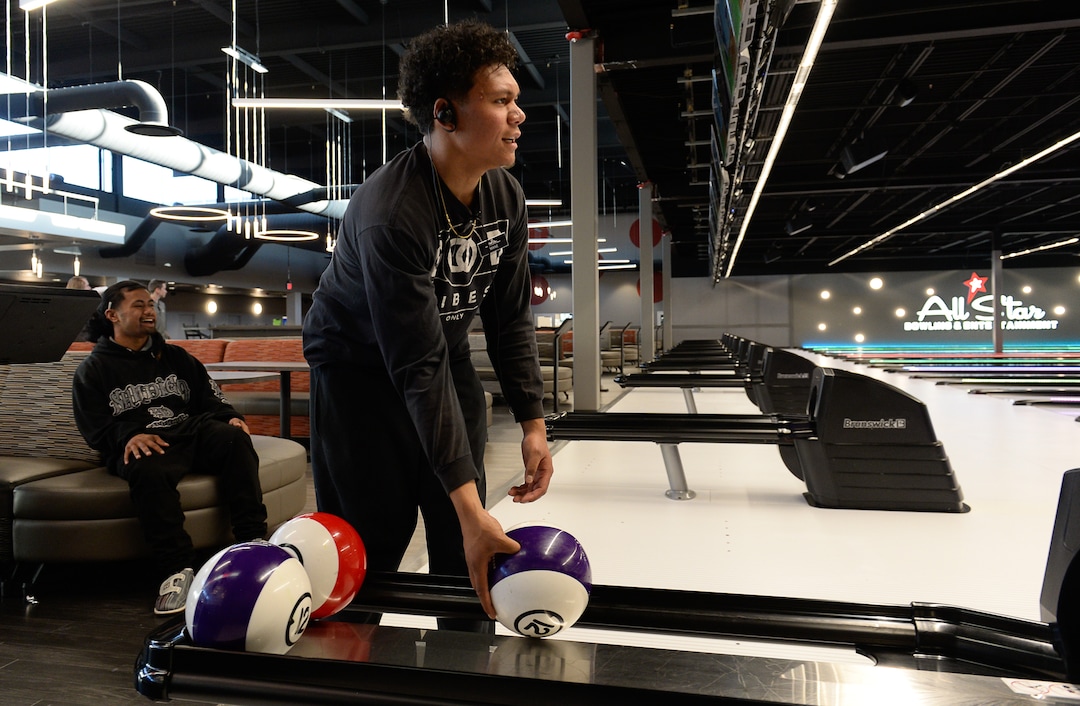 (Francisco Kjolseth  |  The Salt Lake Tribune)  Mathew Ailua, left, and Mane Falaniko take a moment to try their strike game at All Star Bowling which opened a new 70,000 square foot, high-tech bowling and entertainment center at Valley Fair Mall, in West Valley City. It has 32 lanes with luxury seating, laser tag and virtual reality games as well as old-school air hockey, basketball and bumper cars. Inside the center is the new Pins & Ales 21+ bar with more games including axe throwing.