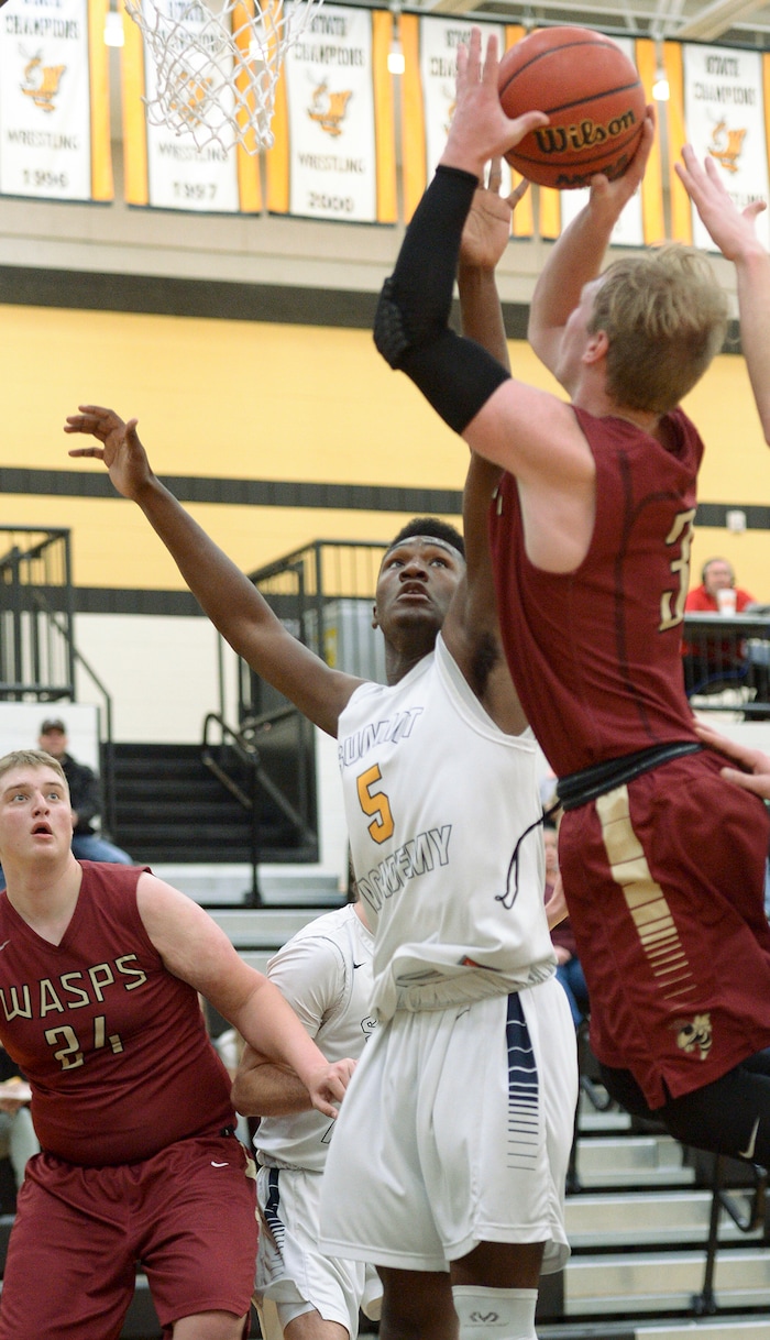 (Leah Hogsten  |  The Salt Lake Tribune) Juab's Alex White shoots around Summit's Jalexus Gilson. Juab High School boys' basketball team defeated Summit Academy 61-58 during their 3A State tournament game in Heber  Saturday, Feb. 16, 2018.