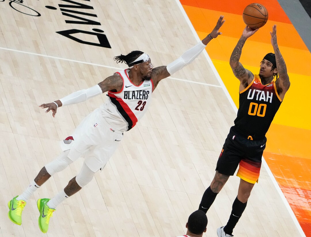 (Francisco Kjolseth | The Salt Lake Tribune) Utah Jazz guard Jordan Clarkson (00) shoots the long shot past Portland Trail Blazers forward Robert Covington (23) in NBA action between the Utah Jazz and the Portland Trail Blazers, at Vivint Smart Home Arena, on Wednesday, May 12, 2021.