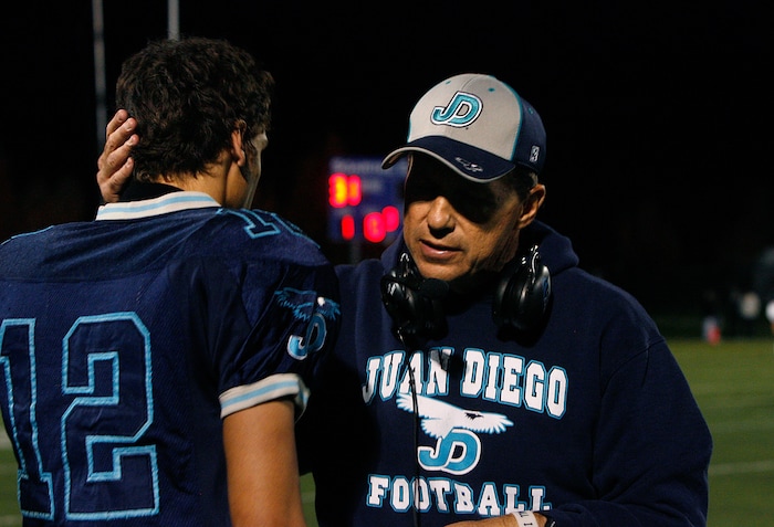 (Scott Sommerdorf | The Salt Lake Tribune) Juan Diego head coach John Colosimo congratulates players after a playoff game in 2012. Colosimo, who also coached at Judge Memorial High School and was a legend in Utah prep sports, died July 8, 2025, at age 69.