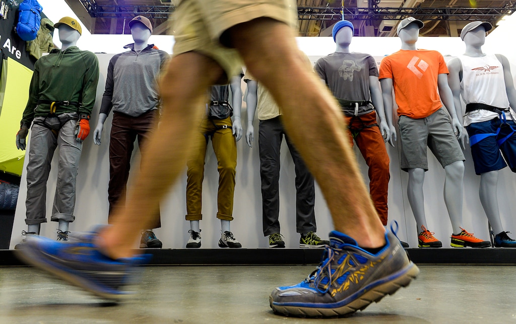 A visitor walks past items on display at the Utah based Black Diamond Equipment booth during the Outdoor Retailer trade show in Salt Lake City on Wednesday, July 26, 2017. The general public is not allowed into the trade show, but OR is finding other ways to encourage public interaction. (Francisco Kjolseth/The Salt Lake Tribune via AP)