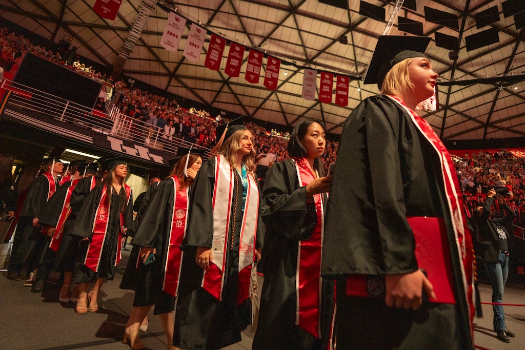 (Rick Egan | The Salt Lake Tribune) Graduates enter the Jon M. Huntsman Center for the University of Utah commencement on Thursday, May 1, 2025. The U. hopes a new free-tuition initiative will help more students access education and graduate. 