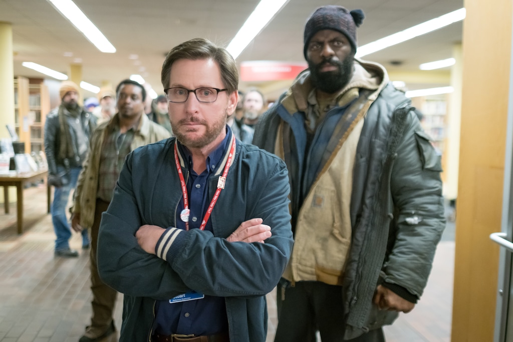 (Photo courtesy of Greenwich Entertainment) Librarian Stuart Goodson (Emilio Estevez, foreground) becomes a spokesman for homeless people — including Big George (played by the hip-hop artist Rhymefest, at right) — who stage a sit-in at The Public Library in Cincinnati, in the drama "The Public," written and directed by Estevez.