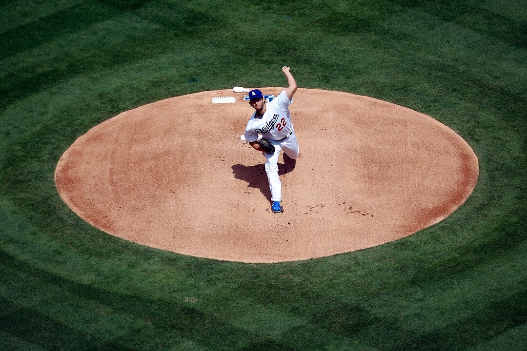 Los Angeles Dodgers starting pitcher Clayton Kershaw throws the first pitch against the San Diego Padres during the first inning of a baseball game, Monday, April 3, 2017, in Los Angeles. (AP Photo/Ryan Kang)