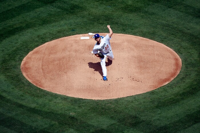 Los Angeles Dodgers starting pitcher Clayton Kershaw throws the first pitch against the San Diego Padres during the first inning of a baseball game, Monday, April 3, 2017, in Los Angeles. (AP Photo/Ryan Kang)