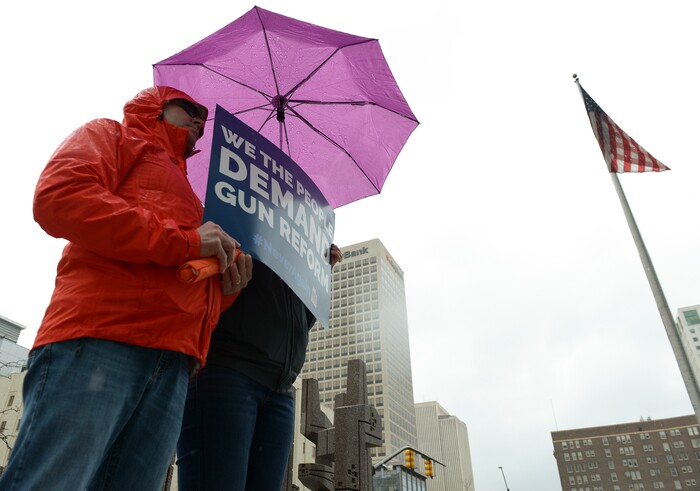 (Leah Hogsten | The Salt Lake Tribune) Roger and Lisa Reese of Sandy show their support of gun reform at the Wallace F. Bennett Federal Building downtown during the #TownHallForOurLives march, Saturday, April 7, 2018, in response to a national call for town hall meetings issued by David Hogg, one of the leaders of the Parkland, FL #NeverAgain movement.