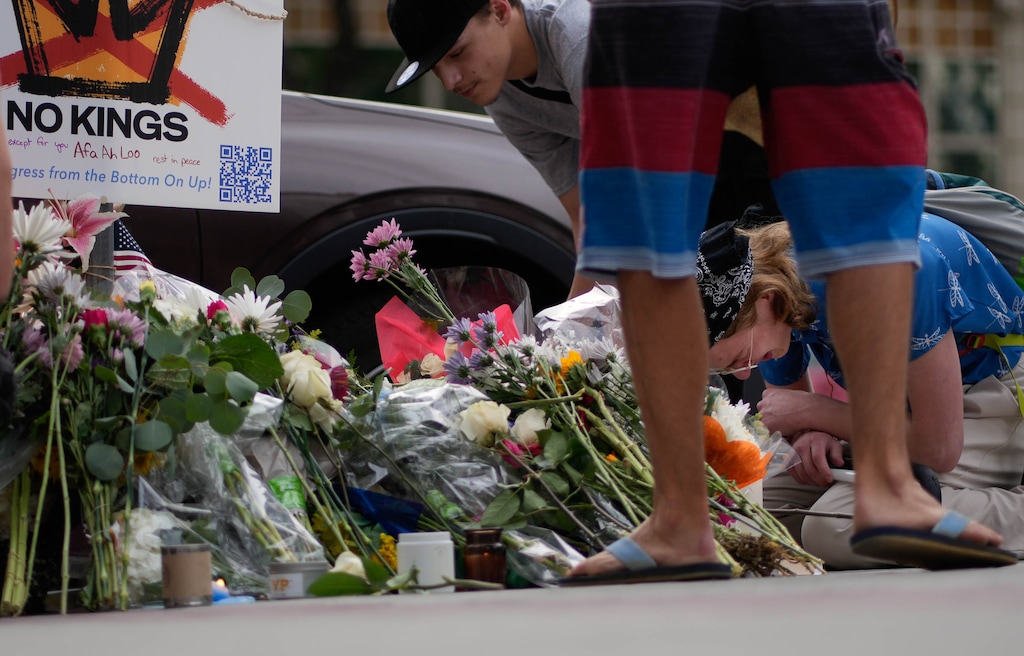 (Francisco Kjolseth | The Salt Lake Tribune) People mourn Arthur Folasa Ah Loo near the Wallace F. Bennett Federal Building in Salt Lake City where he was killed on Monday, June 16, 2025. Ah Loo was an innocent bystander shot during the “No Kings” demonstration downtown on Saturday night.