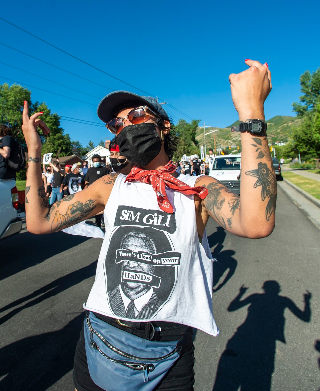 (Rick Egan  |  The Salt Lake Tribune)     Tali dances with in the street with protesters on Foothill Drive during a march for Justice on Sunday, July 12, 2020.