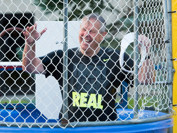 (Rick Egan  |  The Salt Lake Tribune)

 Danny Ainge reacts after being dunked in a dunking booth, at a fundraiser in Provo for his son Tanner Ainge, who is running for congress, in Utah’s third district. Monday, August 7, 2017.