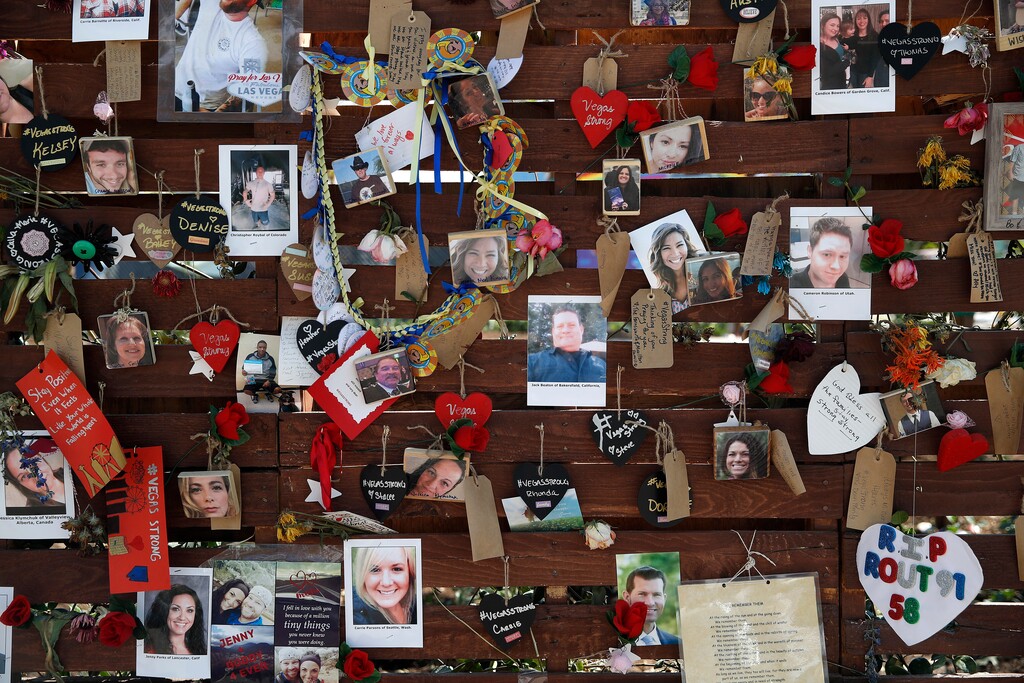 Photos and notes adorn a wall at the Las Vegas Community Healing Garden, Monday, Oct. 16, 2017, in Las Vegas. The garden was built as a memorial for the victims of the recent mass shooting in Las Vegas. (AP Photo/John Locher)