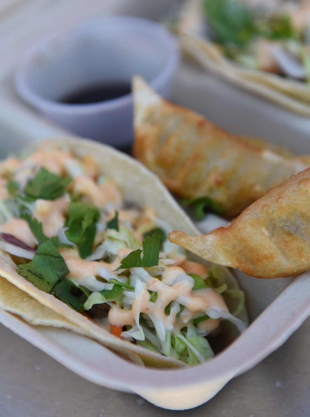 (Francisco Kjolseth  |  The Salt Lake Tribune)  Umai food truck serves Asian street food including tacos and pot stickers.