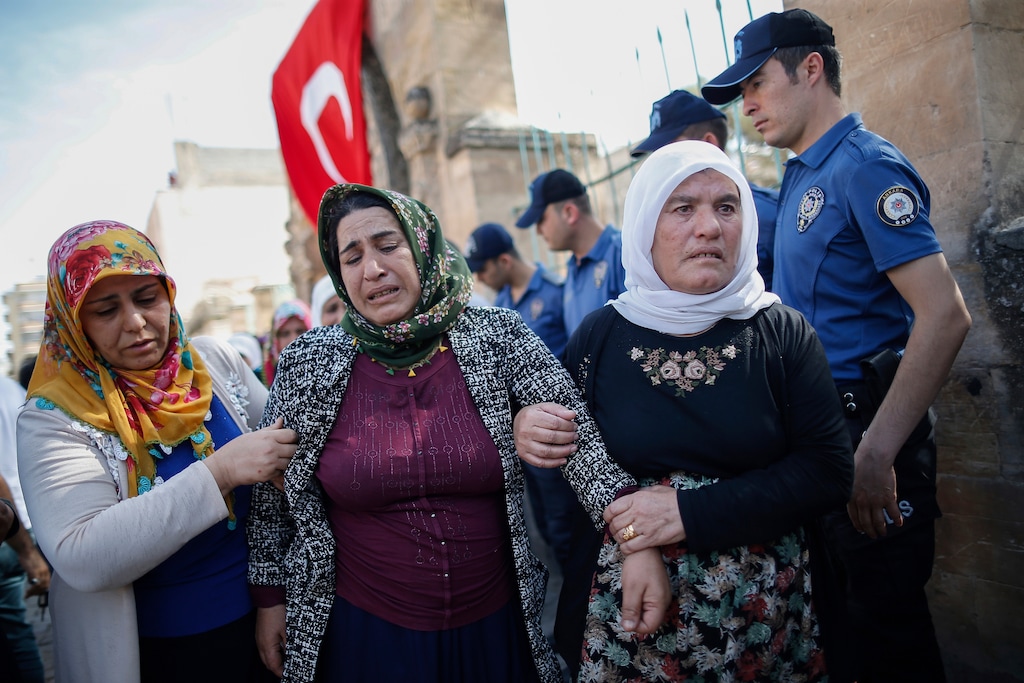 A women cries after the funeral of Ismail Taskin, 38 years old, killed during incoming shelling from Syria Thursday, in Suruc, Sanliurfa province, southeastern Turkey, at the border with Syria, Saturday, Oct. 12, 2019. Turkey says its military offensive has taken central Ras al-Ayn, a key border town in northeastern Syria, and its most significant gain since its cross-border operation began against Syrian Kurdish fighters began. (AP Photo/Emrah Gurel)