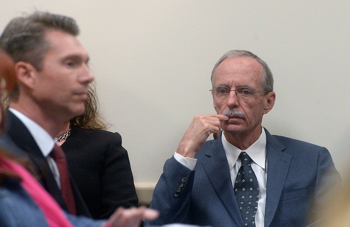 Al Hartmann  |  The Salt Lake Tribune | 
Salt Lake County County Recorder Gary Ott sits before the start of the Salt Lake  County Council's findings of the County Auditor's performance audit  Oct. 4, 2016.  Audit investigator Scott Tingley, left. The Republican served as Salt Lake County recorder for 16 years, but his physical decline from Alzheimer’s set off government inquiries and a legal fight between his family and his fiancee. Ott died Oct. 19, 2017, at a St. George hospice. He was 66.