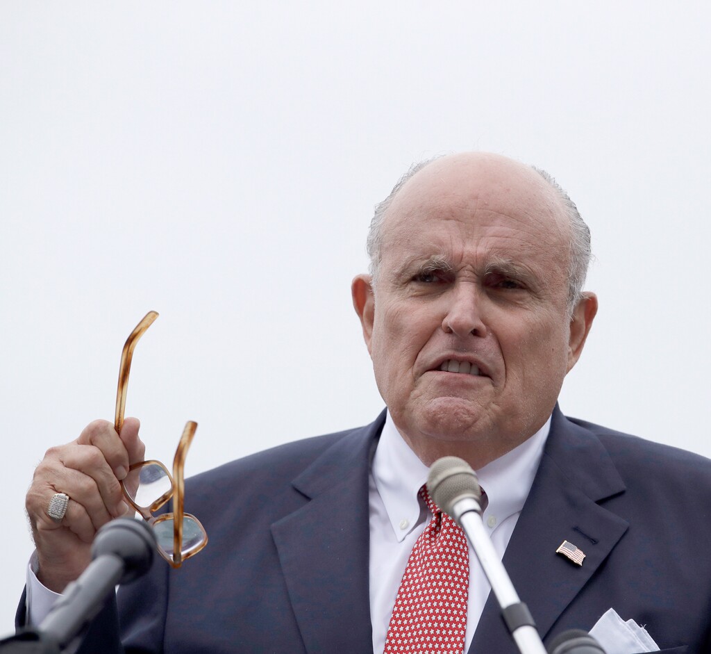 FILE - In a Wednesday, Aug. 1, 2018 file photo, Rudy Giuliani, an attorney for President Trump, speaks during campaign event for Eddie Edwards, who is running for the U.S. Congress in New Hampshire, in Portsmouth, N.H.  “Truth isn’t truth,” says President Donald Trump’s personal attorney Rudy Giuliani, as he explained why he’s wary about pushing the president into an interview that he says could be a perjury trap. Giuliani used the line “truth isn’t truth” Sunday, Aug. 19, 2018, on NBC's "Meet the Press" with Chuck Todd. (AP Photo/Charles Krupa, File)