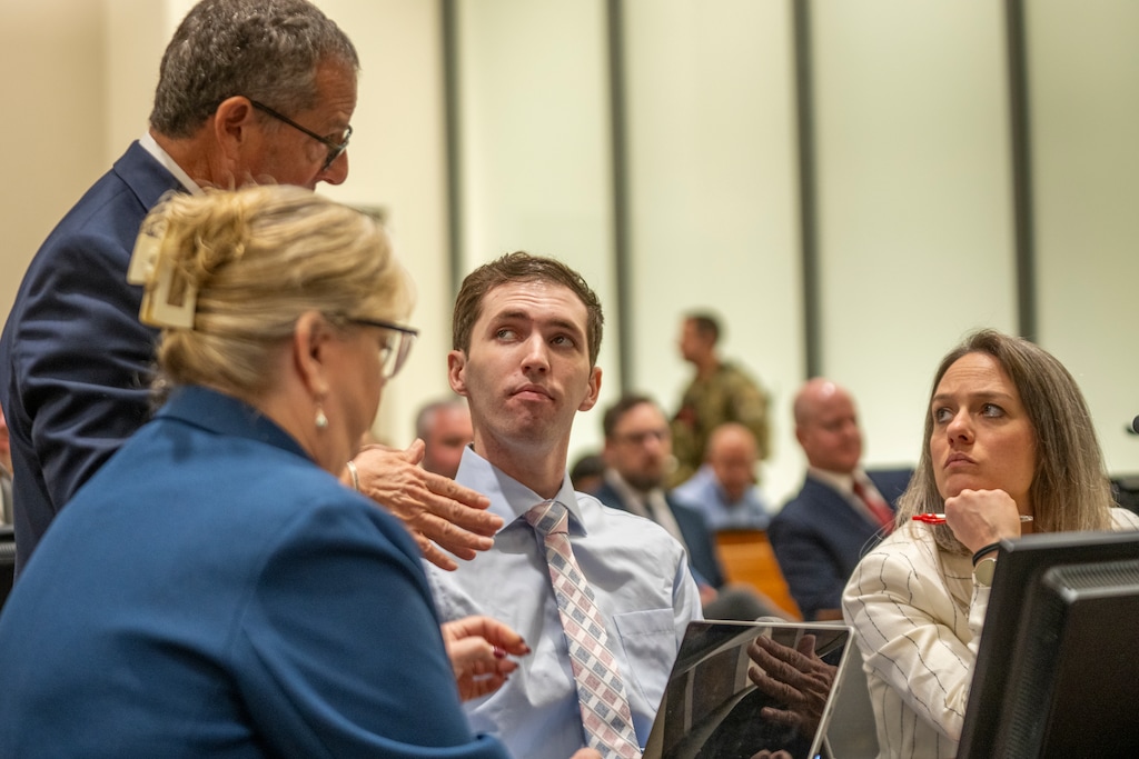 (Rick Egan | The Salt Lake Tribune) Defense attorney Richard Novak speaks with Tyler Robinson as attorneys Kathryn Nester, left, and Staci Visser, right, listen during a December court hearing.