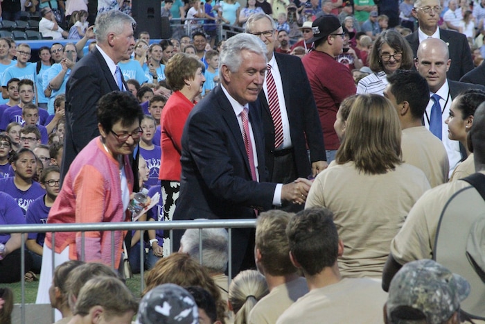 ( Courtesy photo | The Church of Jesus Christ of the Latter-day Saints) Uchtdorf and his wife, Harriet, greet youths before the celebration marking the completion of the Tucson Temple.