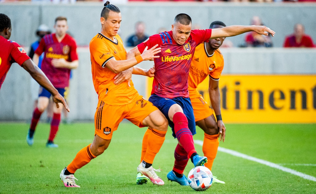 (Isaac Hale | Special to The Tribune) Real Salt Lake forward Bobby Wood (7) tries to drive the ball away from Houston defenders during a MLS game between Real Salt Lake and Houston Dynamo FC at Rio Tinto Stadium in Sandy on Saturday, June 26, 2021.