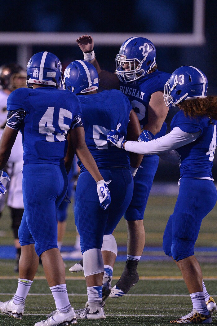 (Leah Hogsten | The Salt Lake Tribune) Bingham's David Latu is celebrated after sacking Lone Peak's quarterback. Bingham High School leads Lone Peak High School, 14-3 during their game Friday, September 28, 2017 in South Jordan.