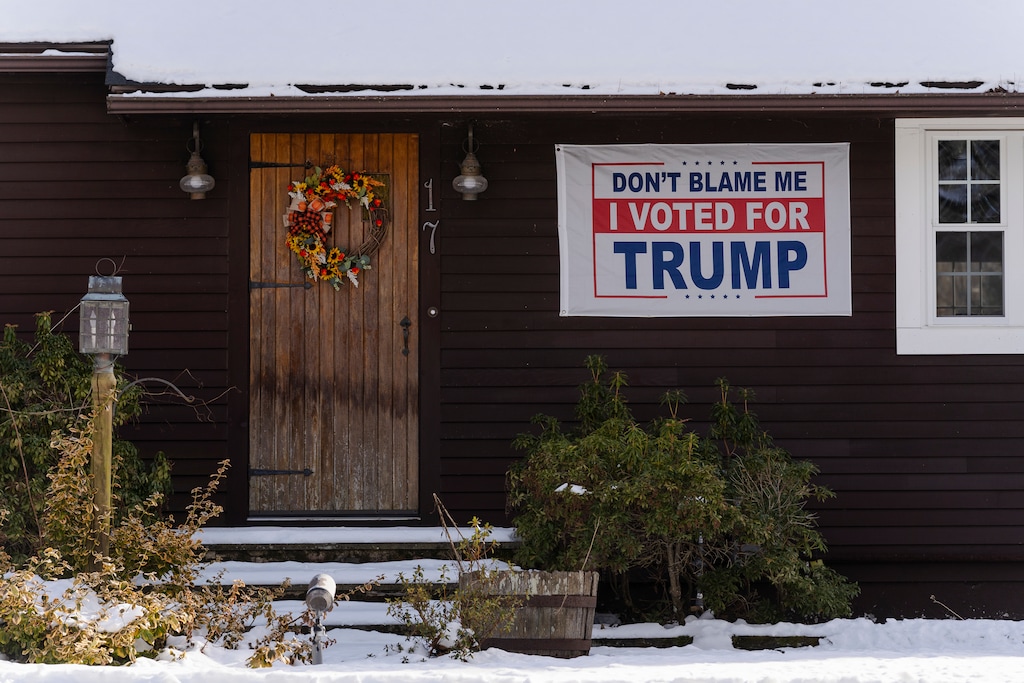 (Sophie Park | The New York Times) A home displays a banner in support of former President Donald Trump, a Republican presidential candidate, ahead of Tuesday’s primary in Hooksett, N.H., Monday, Jan. 22, 2024.