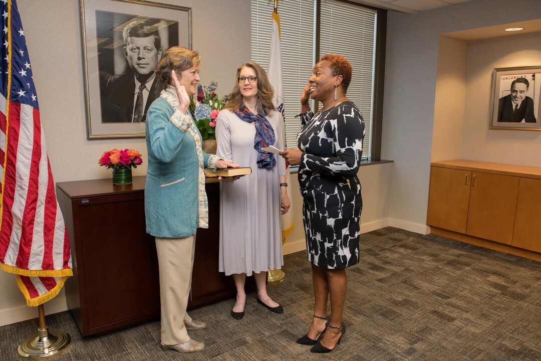 (Courtesy of the Peace Corps) Jody Olsen takes the oath of office to become director of the Peace Corps. The oath was administered by Tina Williams on March 30, 2018. Olsen was accompanied by her daughter, Kirsten Andersen.