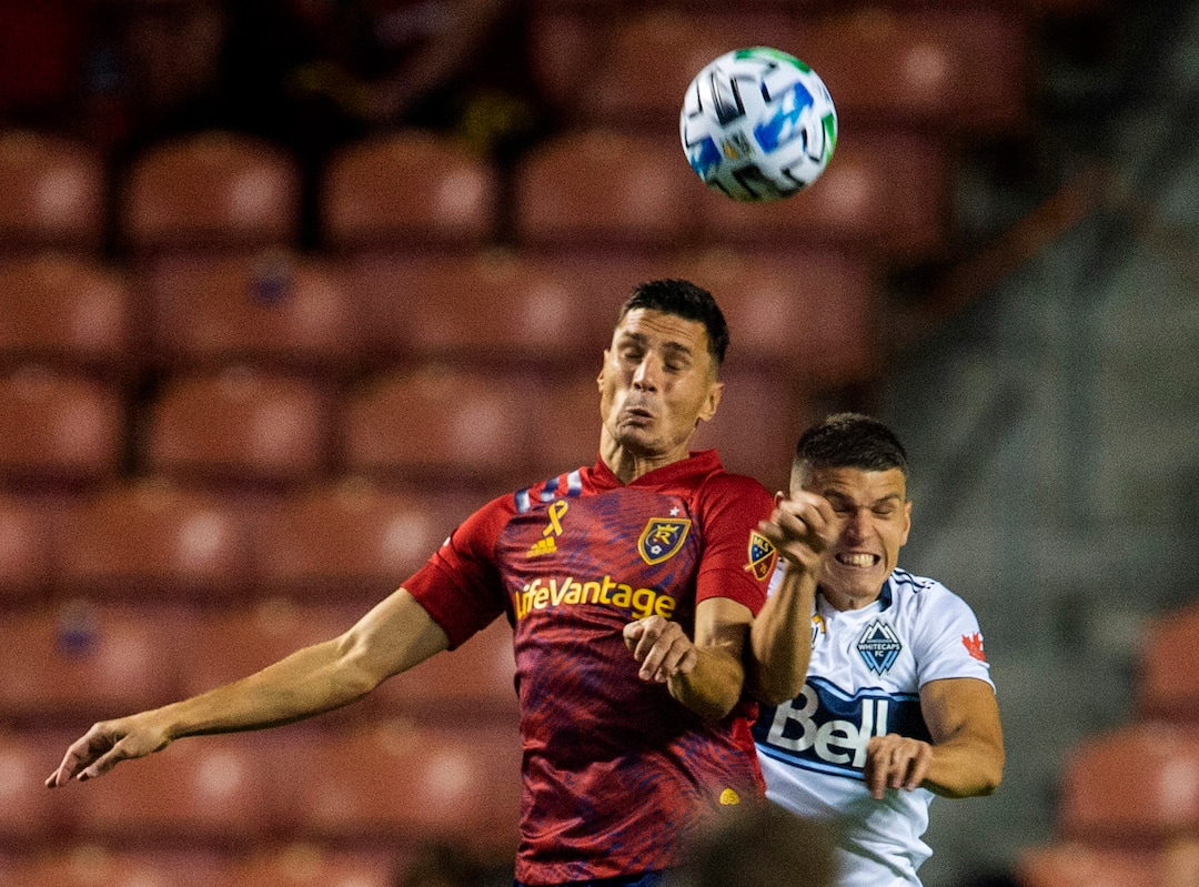 (Rick Egan  |  The Salt Lake Tribune)  Real Salt Lake midfielder Damir Kreilach (8) and Vancouver Whitecaps defender Ranko Veselinovic (4) collide as they go for the ball, in MLS soccer action between Real Salt Lake and the Vancouver Whitecaps at Rio Tinto Stadium on Saturday, Sept. 19, 2020. 
