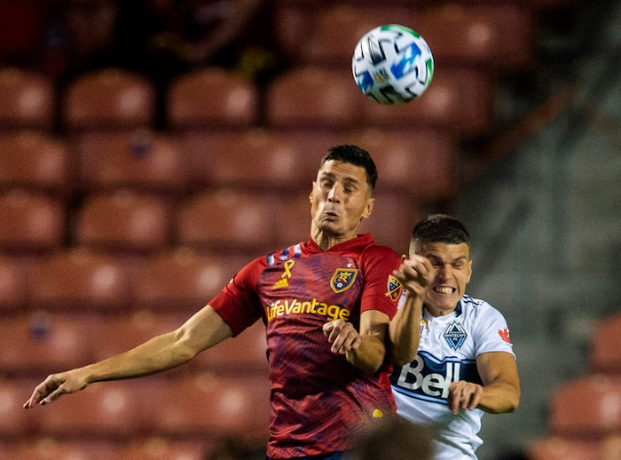 (Rick Egan  |  The Salt Lake Tribune)  Real Salt Lake midfielder Damir Kreilach (8) and Vancouver Whitecaps defender Ranko Veselinovic (4) collide as they go for the ball, in MLS soccer action between Real Salt Lake and the Vancouver Whitecaps at Rio Tinto Stadium on Saturday, Sept. 19, 2020.

 