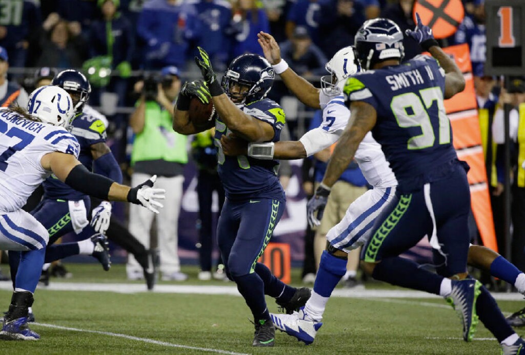 Elaine Thompson | The Associated Press. Seattle Seahawks middle linebacker Bobby Wagner, center, runs for a touchdown after he recovered a fumble from Indianapolis Colts quarterback Jacoby Brissett (7) that was forced by Seahawks' Marcus Smith (97) in the second half of an NFL football game, Sunday, Oct. 1, 2017, in Seattle.