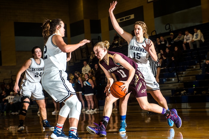 Chris Detrick  |  The Salt Lake TribuneMaple Mountain's Liz Eaton (11) runs past Salem Hills' Lauren Gustin (12) and Salem Hills' Olivia Sampson (15) during the game at Salem Hills High School Tuesday January 12, 2016. Salem Hills won the game 82-63.