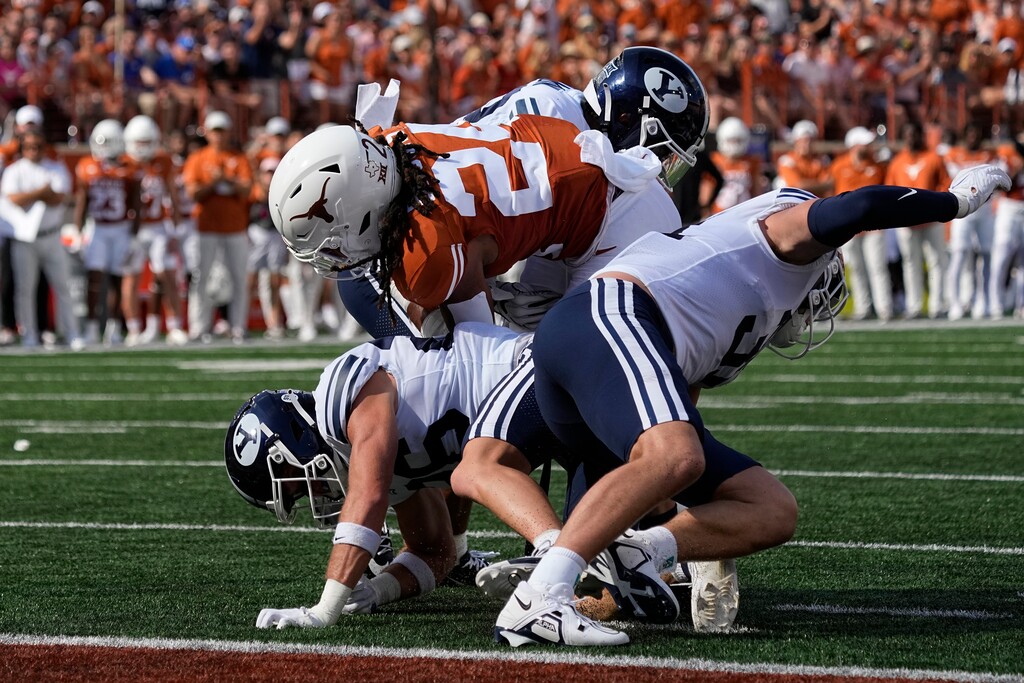 (Eric Gay | AP) Texas running back Jonathon Brooks (24) lunges for a touchdown during the first half against BYU on Saturday.