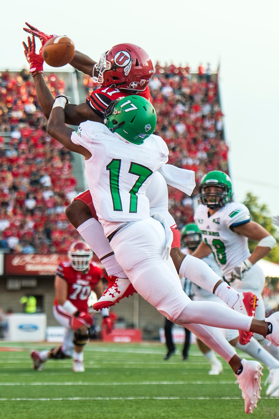 (Chris Detrick  |  The Salt Lake Tribune)  Utah Utes wide receiver Demari Simpkins (17) can't make a potential touchdown catch while being covered by North Dakota Fighting Hawks defensive back Chuck Flowers (17) during the game at Rice-Eccles Stadium Thursday, August 31, 2017. Utah Utes are leading North Dakota Fighting Hawks 17-9 at halftime. 
