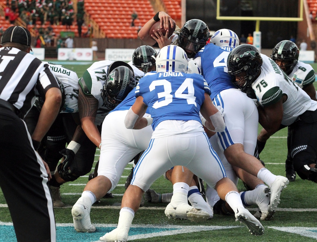 December 24, 2019 - Hawaii Rainbow Warriors quarterback Cole McDonald (13) lunges over the goal line for a touchdown during a game at the SoFi Hawaii Bowl between the Brigham Young Cougars and the Hawaii Rainbow Warriors at the Stan Sheriff Center in Honolulu, HI - Michael Sullivan/CSM.(Credit Image: &copy; Michael Sullivan/CSM via ZUMA Wire) (Cal Sport Media via AP Images)