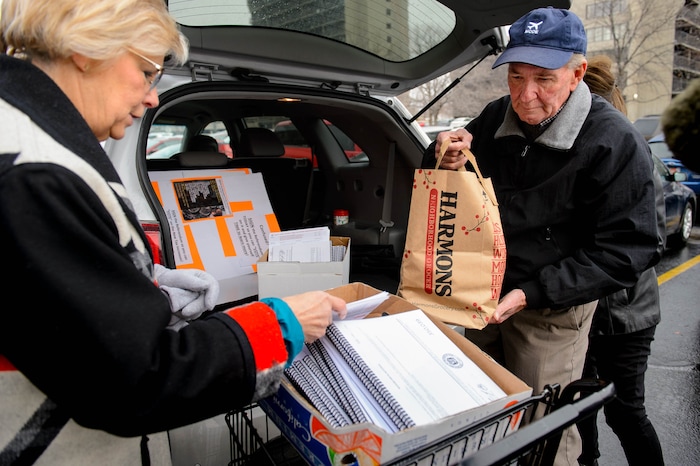 (Trent Nelson | The Salt Lake Tribune) Volunteers Claudine Peterson and Kent Jorgenson collect signed tax referendum petitions outside of the Salt Lake County Clerk's Office in Salt Lake City on Tuesday, Jan. 21, 2020.