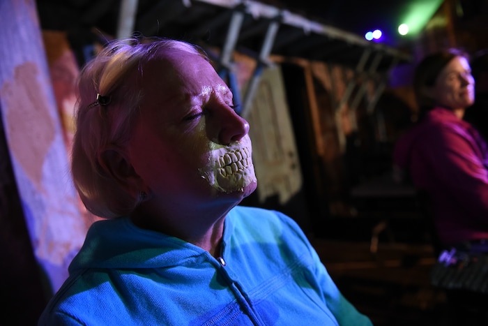 (Francisco Kjolseth  |  The Salt Lake Tribune)  State Senator Karen Mayne undergoes a drastic transformation with the help of makeup artist Jez Roberts as local politicians fall prey to the zombie apocalypse at the Fear Factory on Thursday, Oct. 12, 2017, for a special event to raise awareness of the Utah Food Bank and kick start donations. 