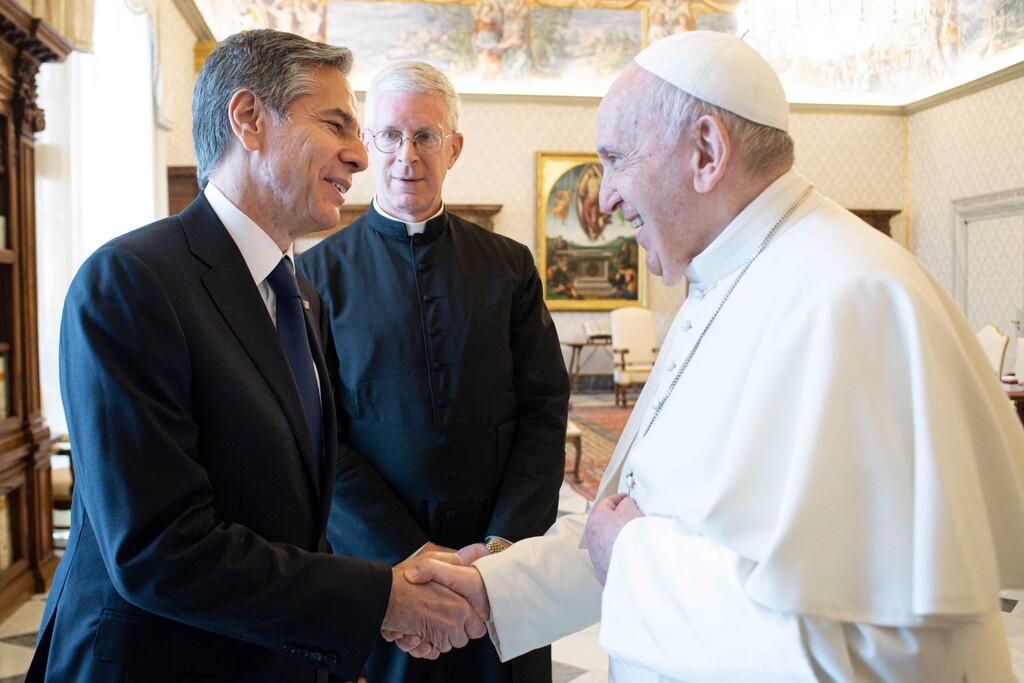 (Vatican Media via AP Photo) Pope Francis shakes hands with Secretary of State Antony Blinken as they meet at the Vatican, Monday, June 28, 2021. Blinken is on a weeklong trip in Europe, traveling to Germany, France and Italy.
