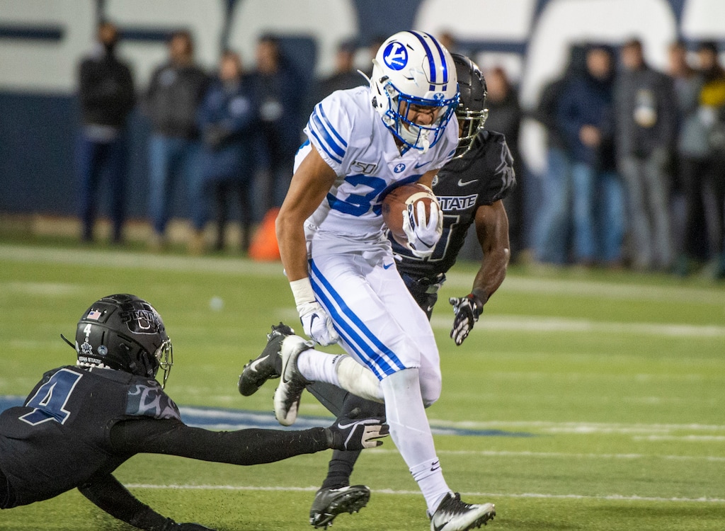 (Rick Egan  |  The Salt Lake Tribune)       Brigham Young Cougars running back Sione Finau (35) runs the ball for the Cougars, in football action between Brigham Young Cougars and Utah State Aggies in Logan, Saturday, Nov. 2, 2019.