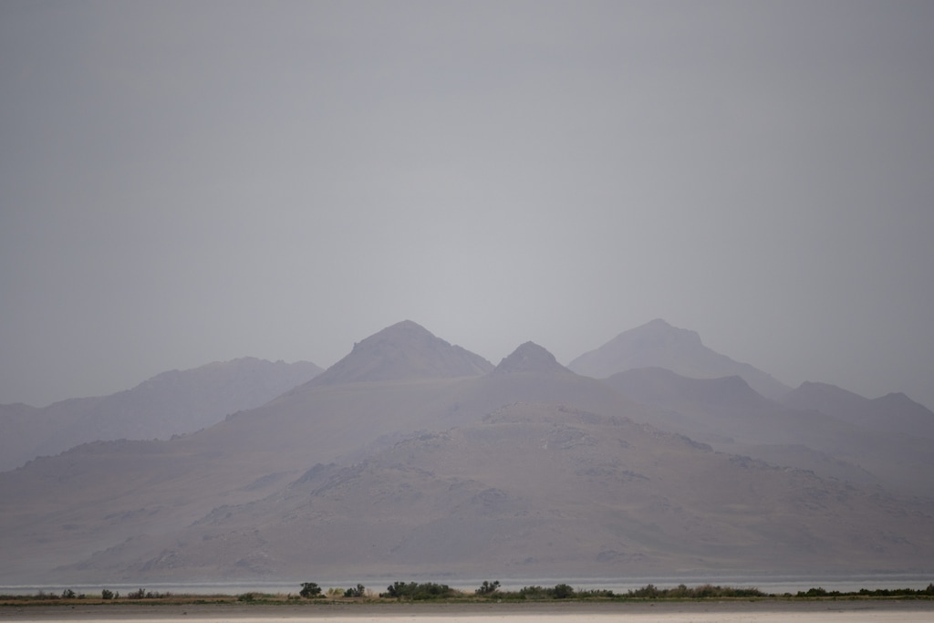 (Trent Nelson  |  The Salt Lake Tribune) Dust obscures Antelope Island and the Great Salt Lake on Saturday, June 18, 2022.