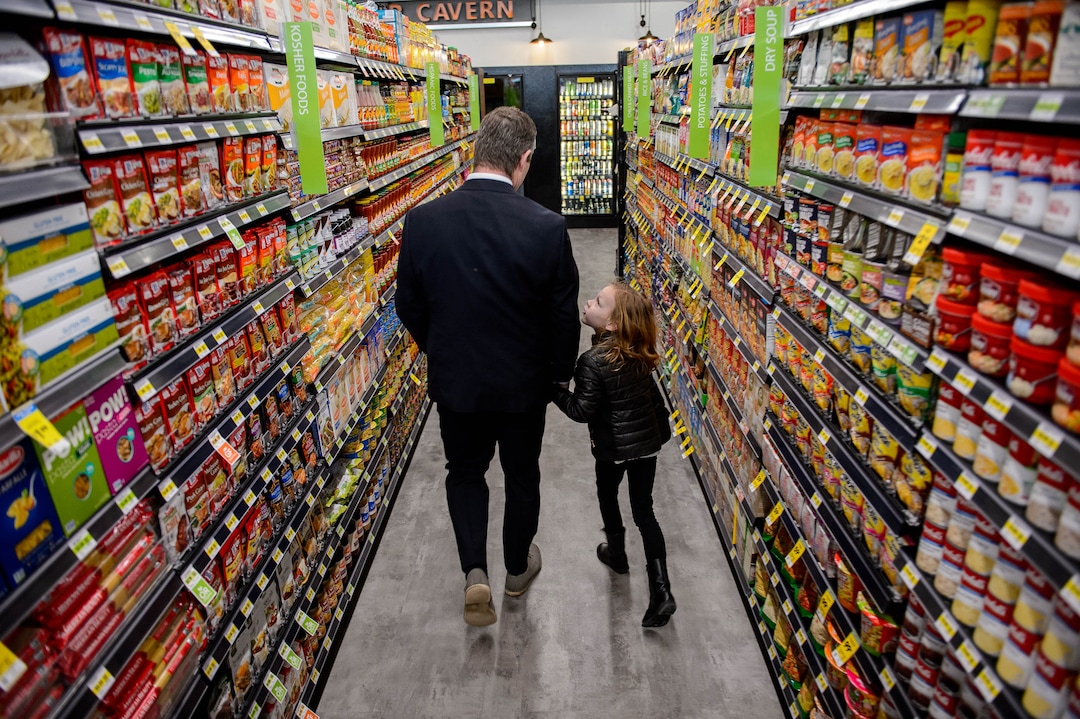 (Trent Nelson  |  The Salt Lake Tribune) Jonathan Badger with his daughter Madison at the new Lee's Market in Salt Lake City on Thursday, Feb. 6, 2020.