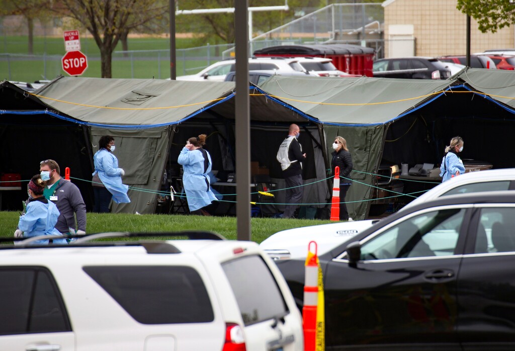 (Erin Bormett | The Argus Leader via AP)
In this May 4 photo, health care workers run a coronavirus testing site for Smithfield employees in the Washington High School parking lot on Monday, May 4, 2020 in Sioux Falls, S.D. North Dakota and South Dakota have the nation's worst rate of coronavirus deaths per capita in the last 30 days. Despite advances in treating coronavirus patients, hundreds more people in the Dakotas have died in recent weeks than during any other time of the pandemic.