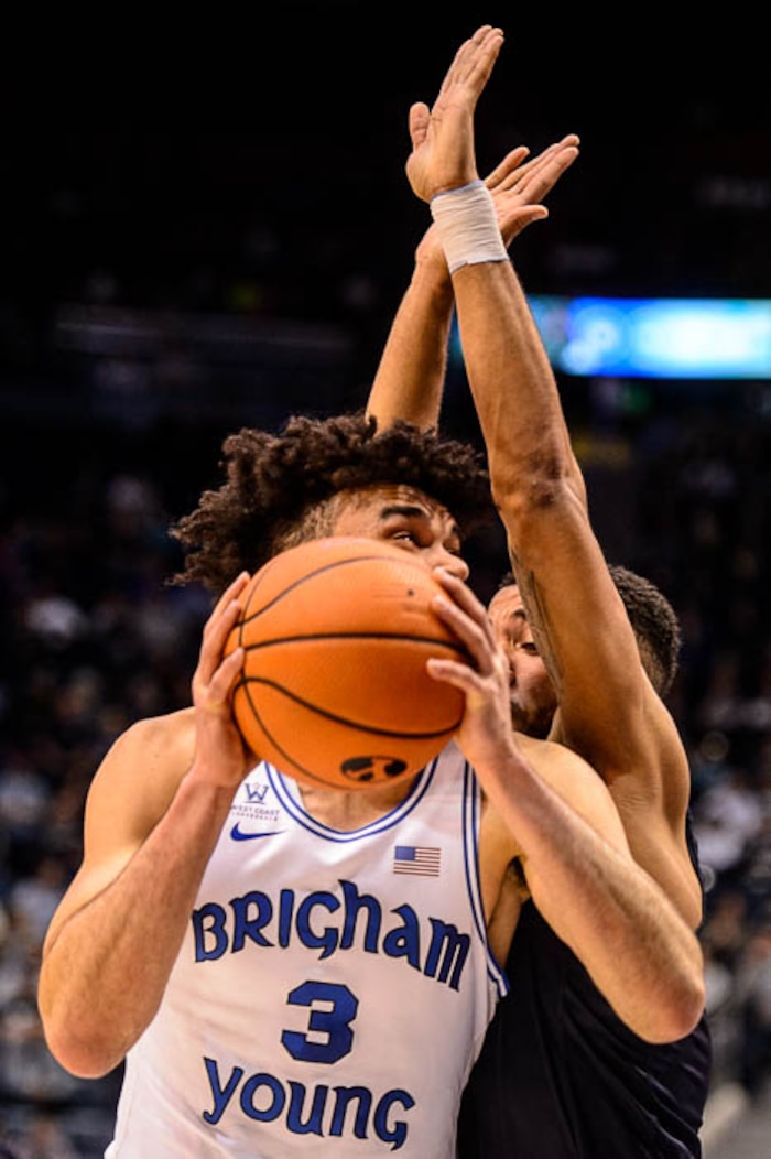 (Trent Nelson | The Salt Lake Tribune)   Brigham Young Cougars guard Elijah Bryant (3) and San Diego Toreros guard Olin Carter III (3) as BYU hosts San Diego, NCAA basketball in Provo Saturday January 20, 2018.