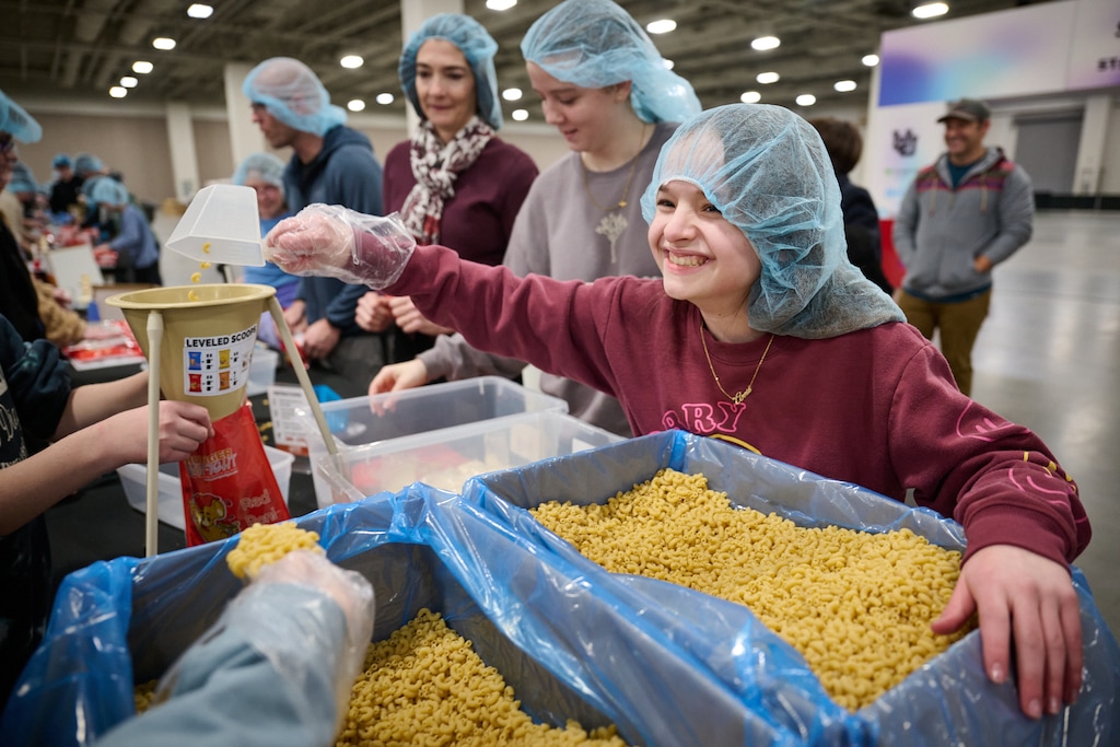 (The Church of Jesus Christ of Latter-day Saints) Latter-day Saint young people help assemble meals for distribution to Utah food banks.
