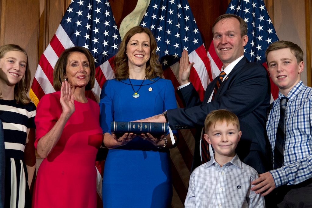 House Speaker Nancy Pelosi of Calif., administers the House oath of office to Rep.Ben McAdams D-Utah, during a ceremonial swearing-in on Capitol Hill in Washington, Thursday, Jan. 3, 2019, during the opening session of the 116th Congress. (AP Photo/Jose Luis Magana)