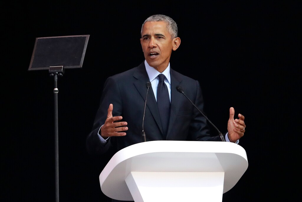 (Themba Hadebe | The Associated Press) Former U.S. President Barack Obama, left, delivers his speech at the 16th Annual Nelson Mandela Lecture at the Wanderers Stadium in Johannesburg, South Africa, Tuesday, July 17, 2018. In his highest-profile speech since leaving office, Obama urged people around the world to respect human rights and other values under threat in an address marking the 100th anniversary of anti-apartheid leader Nelson Mandela's birth.