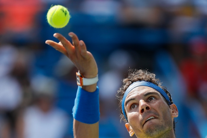 Rafael Nadal, of Spain, serves to Albert Ramos-Vinolas, of Spain, at the Western & Southern Open tennis tournament, Friday, Aug. 18, 2017, in Mason, Ohio. (AP Photo/John Minchillo)