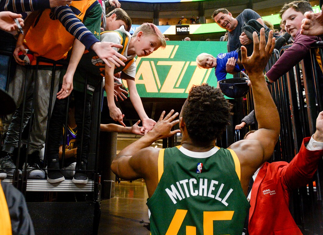Leah Hogsten  |  The Salt Lake Tribune  Utah Jazz guard Donovan Mitchell (45) celebrates the win with fans. The Utah Jazz defeated the Portland Trail Blazers, 117-96, Christmas night at Vivint Smart Home Arena.