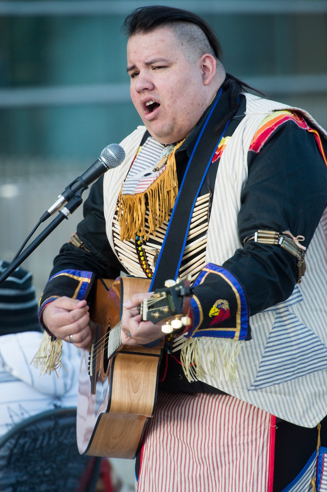 (Rick Egan  |  The Salt Lake Tribune)  Mason Runsthrough, performs an original song, during the Indigenous Peoples Day celebration, hosted by the Utah League of Native American Voters and PANDOS (Peaceful Advocates for Native Dialogue and Organizing Support) at the Salt Lake City Library, Monday, October 9, 2017.