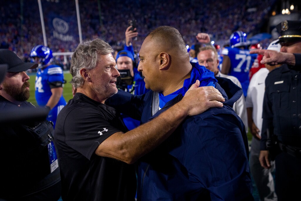 (Trent Nelson  |  The Salt Lake Tribune) Utah Utes head coach Kyle Whittingham and BYU Cougars head coach Kalani Sitake after the game at LaVell Edwards Stadium in October.