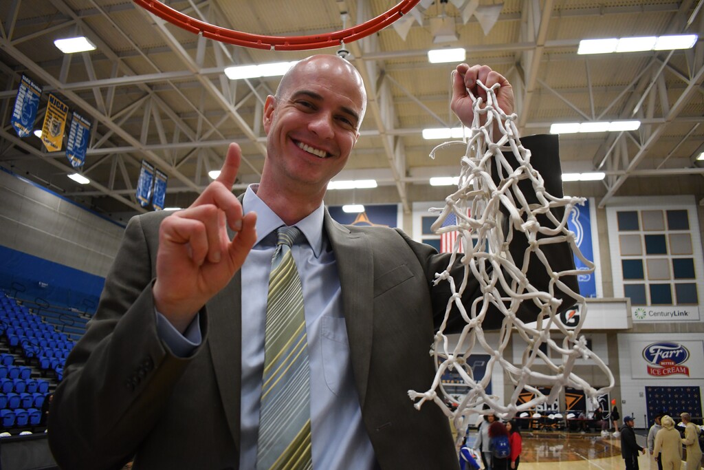 (Photo courtesy of Taylor Munroe | SLCC Athletics) Salt Lake Community College men's basketball coach Kyle Taylor celebrates the Bruins' NJCAA West District Championship win over Eastern Arizona on March 7.