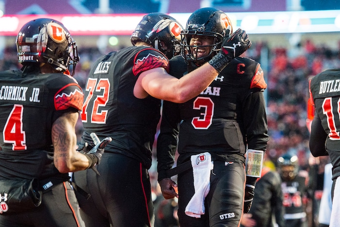 Chris Detrick  |  The Salt Lake Tribune
Utah Utes offensive lineman Garett Bolles (72) and Utah Utes quarterback Troy Williams (3) celebrate after Williams' touchdown during the first half of the game at Rice-Eccles Stadium Friday September 23, 2016. 