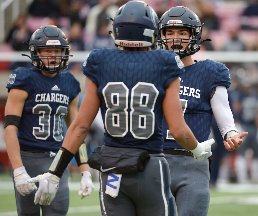 (Leah Hogsten  |  The Salt Lake Tribune) Corner CanyonÕs Cole Hagen talks with Kobe Peters.  Corner Canyon High School takes on American Fork High School during the 6A State Championship football title, Nov. 22, 2019 at Rice-Eccles Stadium.