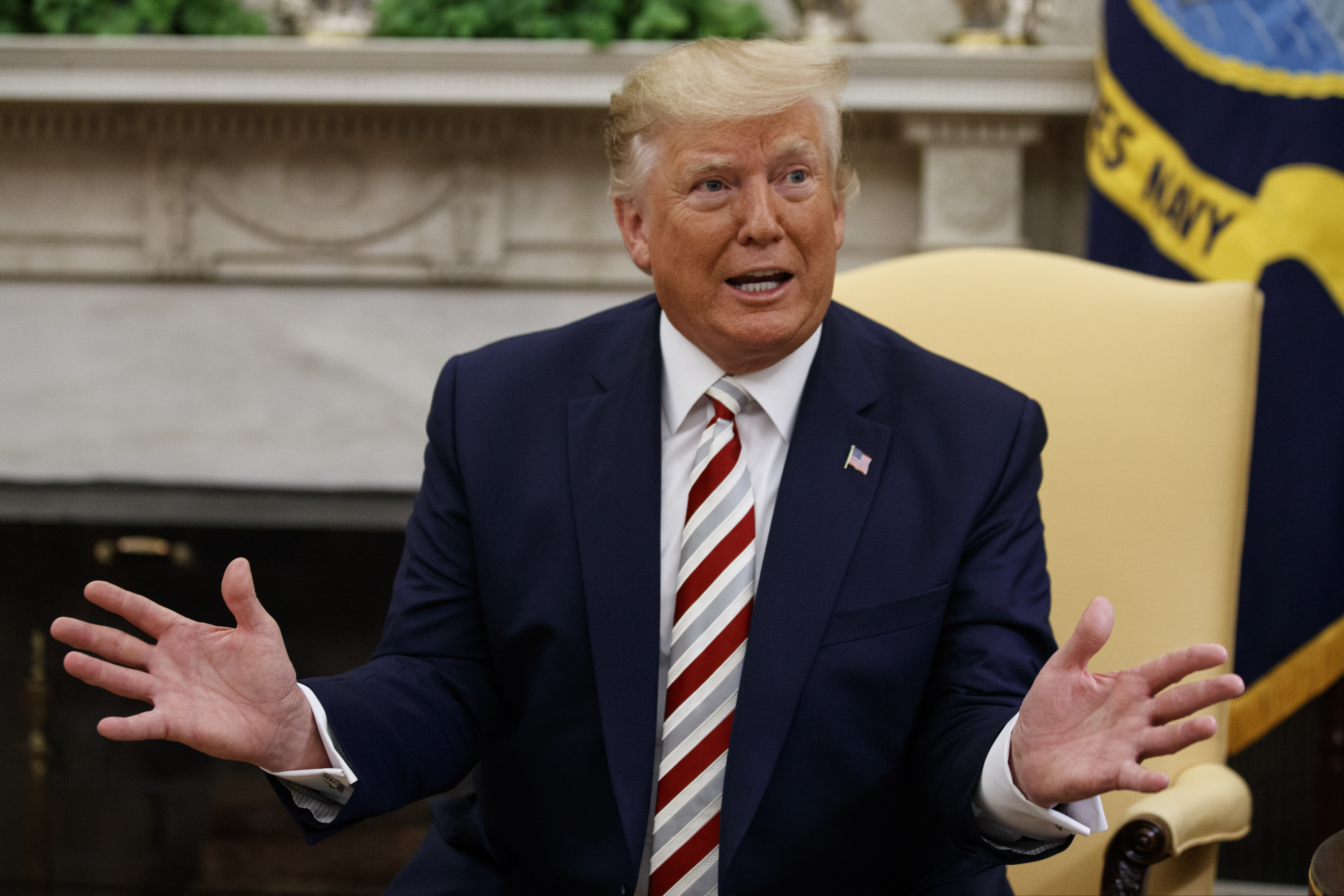 (Alex Brandon | AP) President Donald Trump speaks during a meeting with Romanian President Klaus Iohannis in the Oval Office of the White House, Tuesday, Aug. 20, 2019, in Washington. Earlier in the day, Trump spent at least 30 minutes on the phone with Wayne LaPierre, the chief executive of the National Rifle Association.
